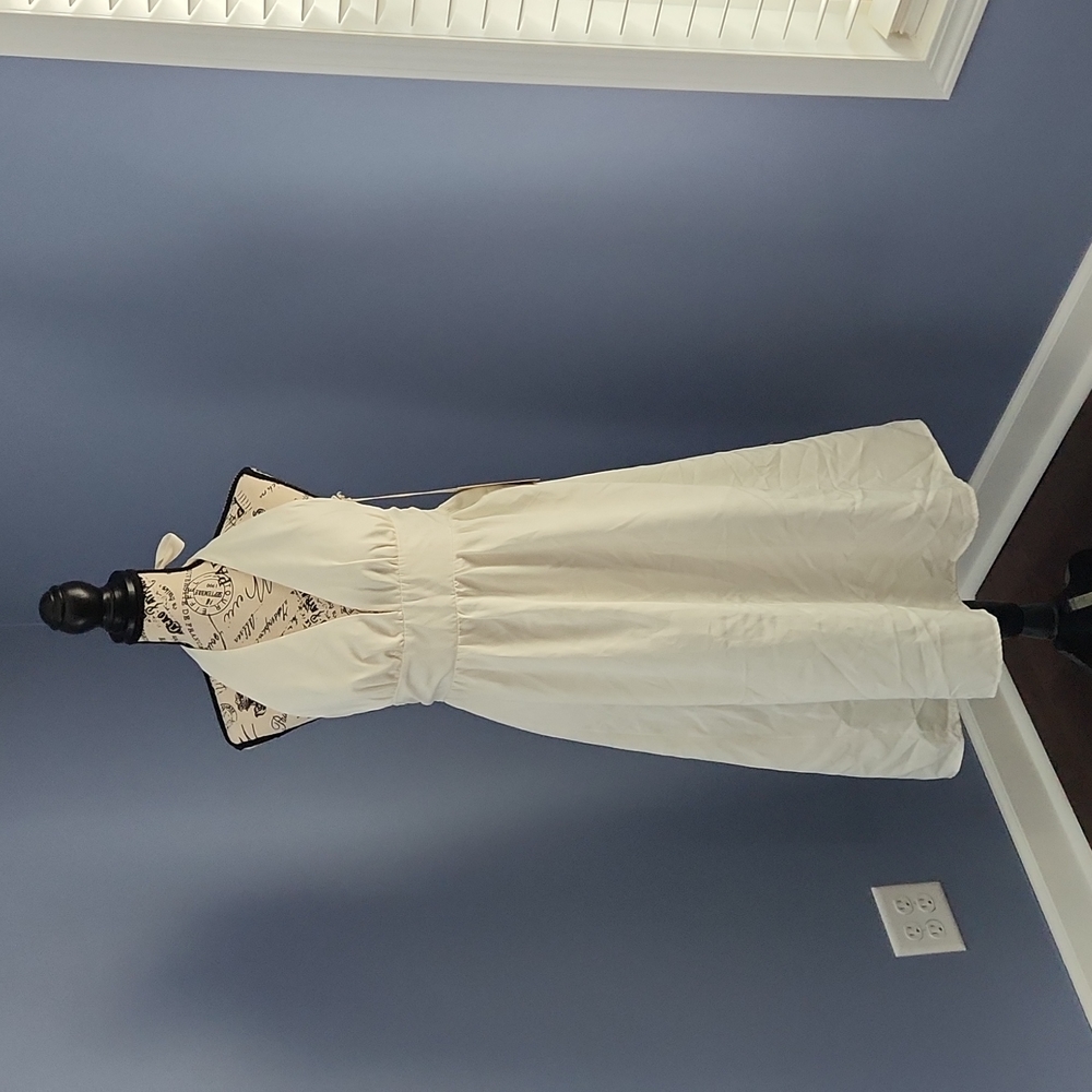 NWT sexy white halter style (tie in back) with optional built in modesty panel.